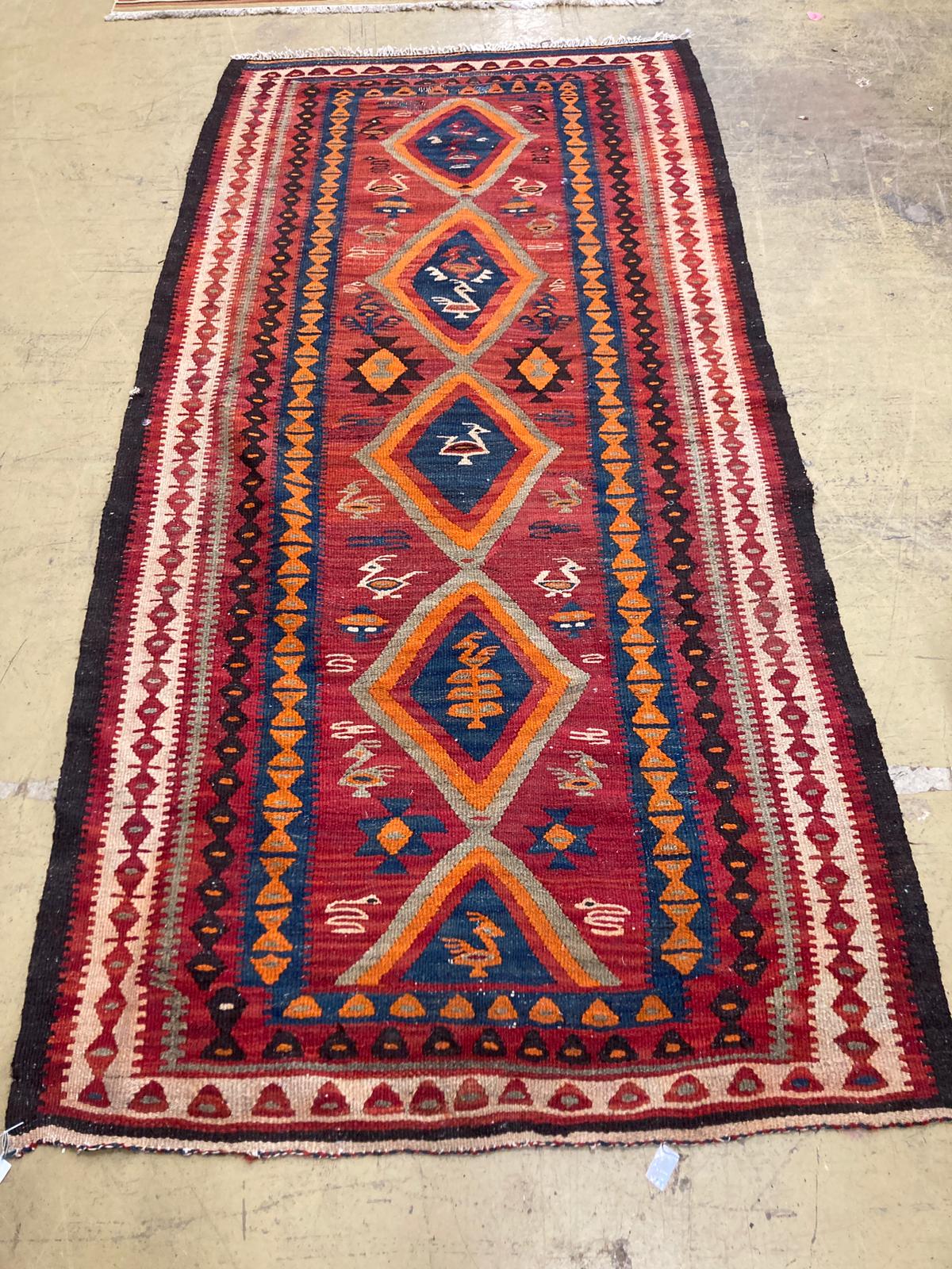 A polychrome Kelim rug, 270 x 134cm.